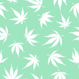 seamless pattern of white cannabis leaves on a green background. White hemp leaves. Marijuana pattern