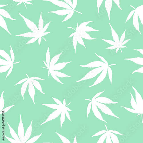 seamless pattern of white cannabis leaves on a green background. White hemp leaves. Marijuana pattern