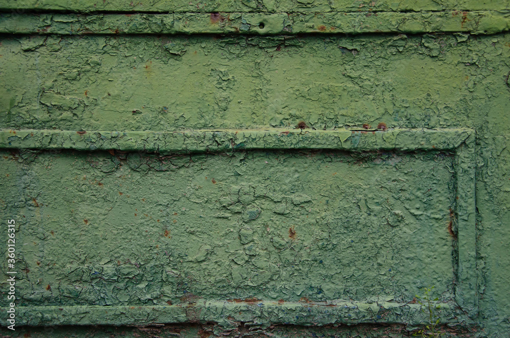Stretched green cracked paint rough layer of cracked paint texture.