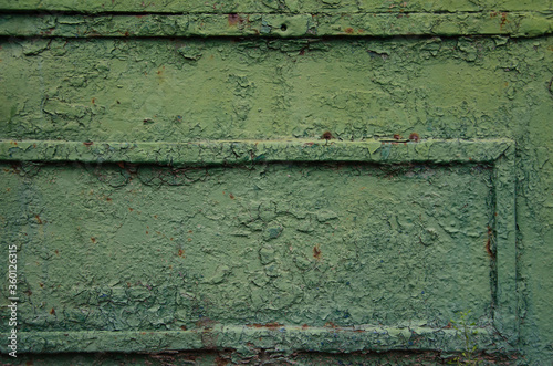 Stretched green cracked paint rough layer of cracked paint texture. © Yaroslav
