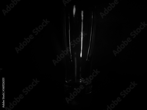 Empty glass isolated on black background