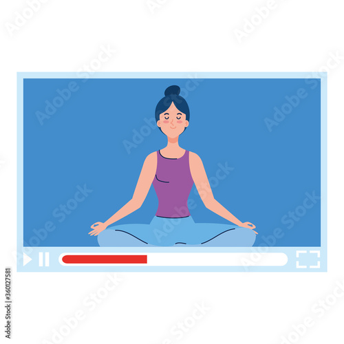 online, yoga concept, woman practices yoga and meditation, watching a broadcast on a web page