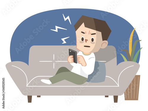 ソファーで横になる携帯電話依存症の若い男性