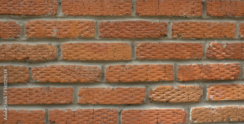 Texture of a brick wall with diamond-shaped reliefs
