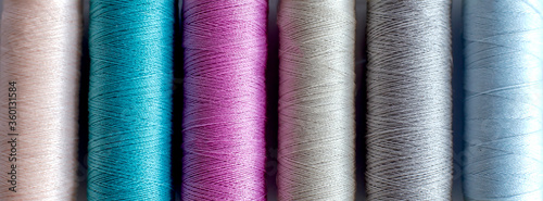 Konstfotografi Colored thread in spools on white backgrond