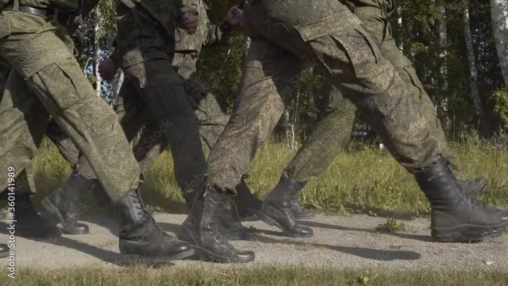 Soldiers marching on street, close-up feet Soldiers marching on street, close-up feet