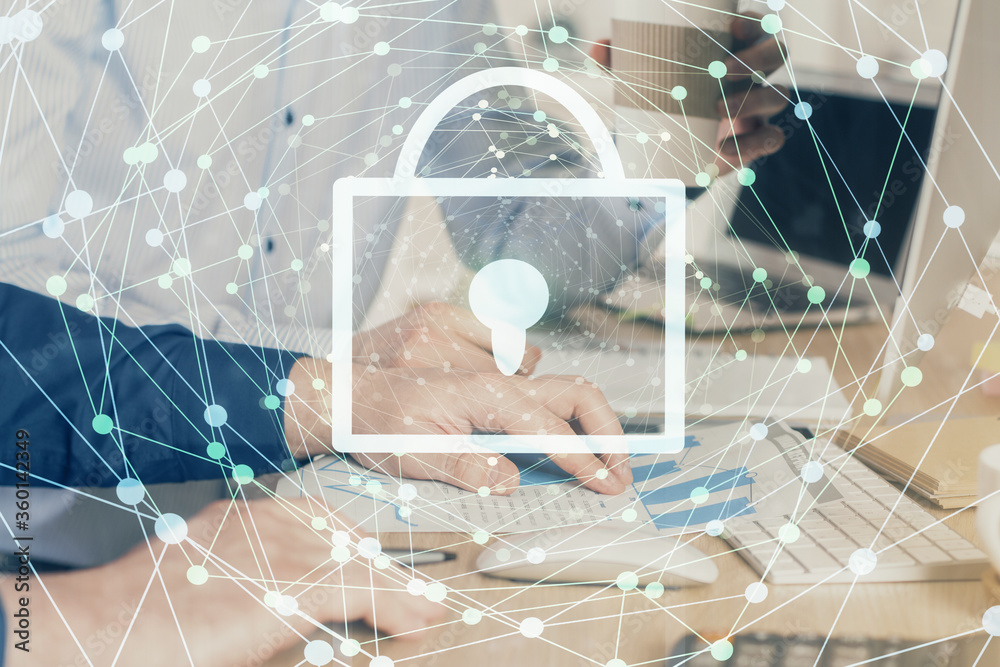 Multi exposure of lock icon with man working on computer on background. Concept of network protection. Multi exposure of lock icon with man working on computer on background. Concept of network protection.