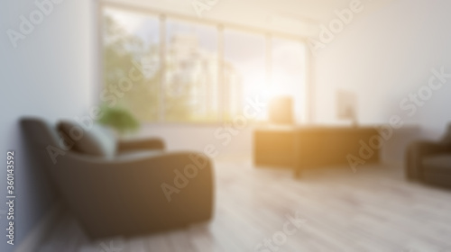 Unfocused, Blur phototography. Head office with a large window. modern furniture.. 3D rendering. Sunset