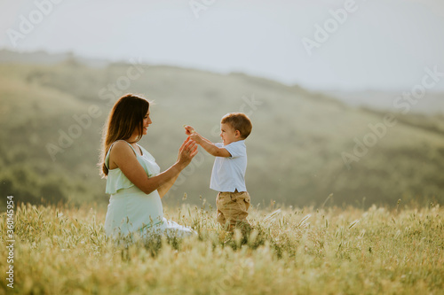 Young pregnant mother with ...
