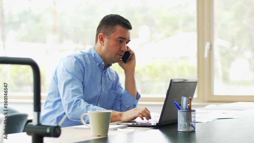 remote job, technology and business concept - middle-aged man with laptop computer calling on smartphone at home office