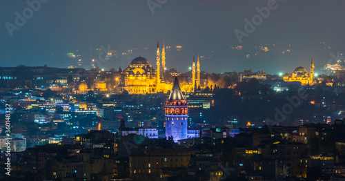 Galata Tower and Suleymaniye Mosque at night in Istanbul  Turkey.