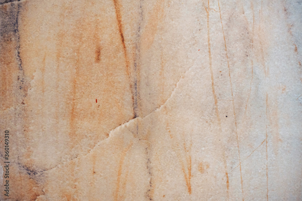 Warm natural marble texture with scratches. Backdrop to use for design or art work.
