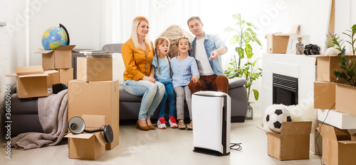 family with an air purifier moving to a new apartment