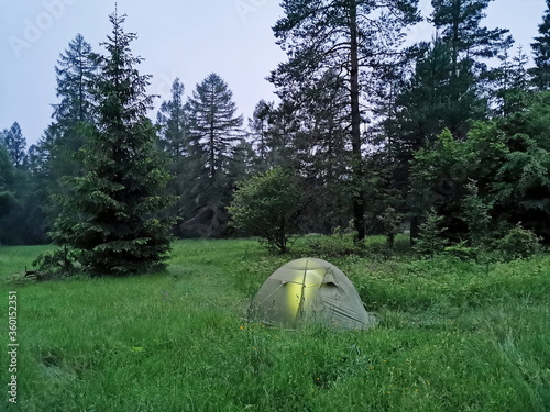 Poland Pieniny. Tent pitched in a foggy clearing.
