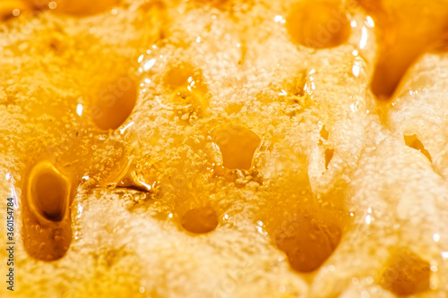 Photos Macro photo of a toasted crumpet with honey