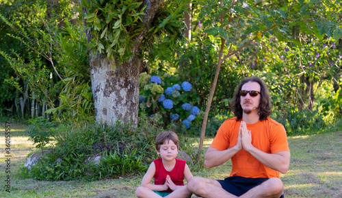 Uncle and nephew meditating and playing in nature.