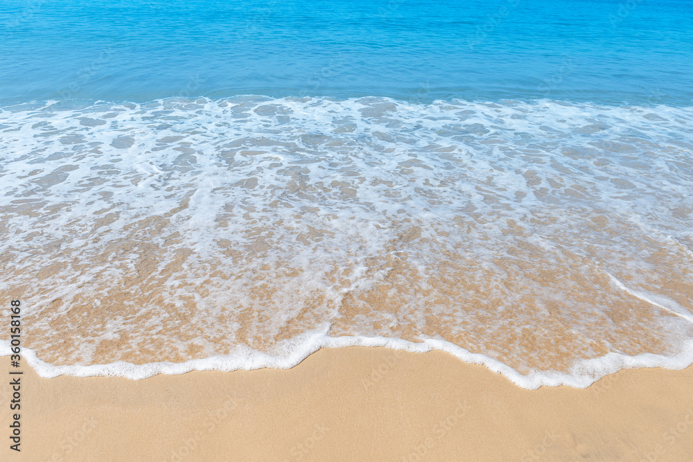 White wave on the fine sand beach, environmental and nature concept background, summer outdoor day light, beautiful beach