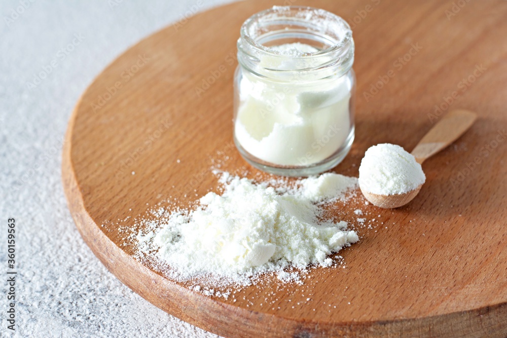 Collagen powder with on a light background. Extra protein intake. Natural beauty and health supplement for skin, bones, joints and gut. Collagen powder with on a light background. Extra protein intake. Natural beauty and health supplement for skin, bones, joints and gut.