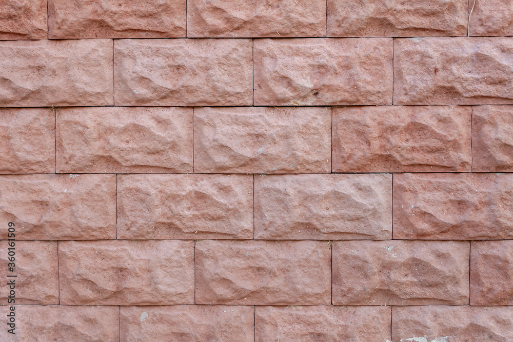 Obraz premium Decorative brick wall texture or background. Dirty wall outside of a house