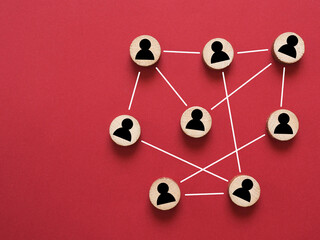 Abstract teamwork, network and community concept on a red paper background
