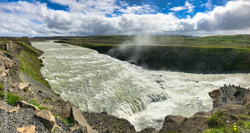 Top panoramic view of Gullfoss waterfall on the Hvítá river, a popular tourist attraction and part of the Golden Circle Tourist Route in Southwest Iceland. Golden Waterfall