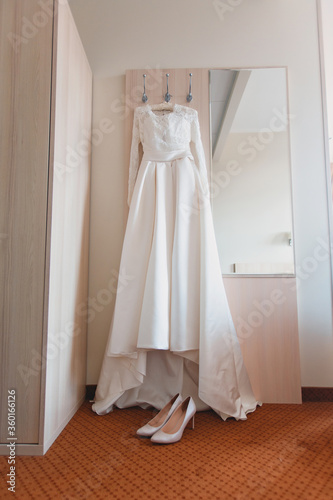 white wedding dress on a hanger