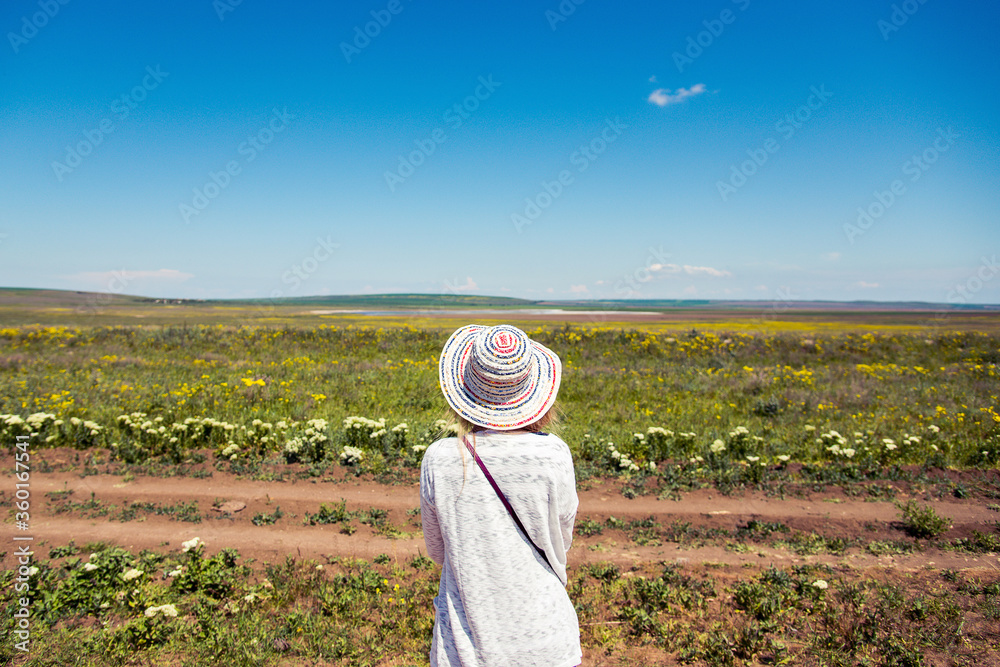 girl in a hat in the field
