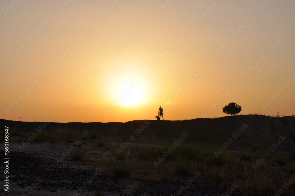 silhouette of a man on a sunset