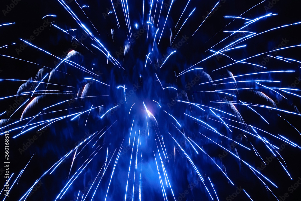 Obraz premium Sparkling fireworks display against the night sky. abstract background for celebration merry christmas, birthdays, Victory Day, independence, holidays, celebration, party, festival, new year concept
