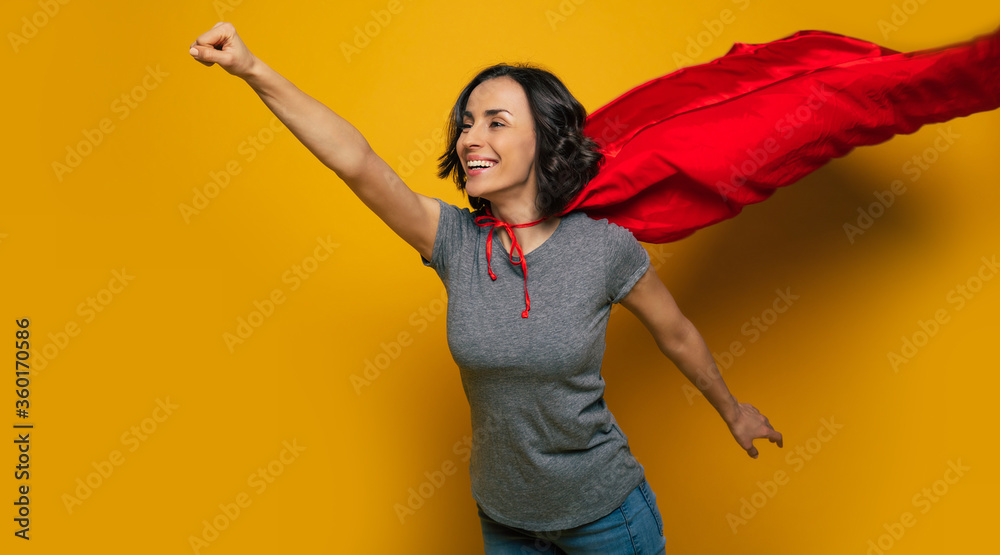 I am coming to you! A half-length photo of a young, beautiful girl, pretending she is a superwoman, and flying in a classic superman pose, because she is flying to help someone. I am coming to you! A half-length photo of a young, beautiful girl, pretending she is a superwoman, and flying in a classic superman pose, because she is flying to help someone.