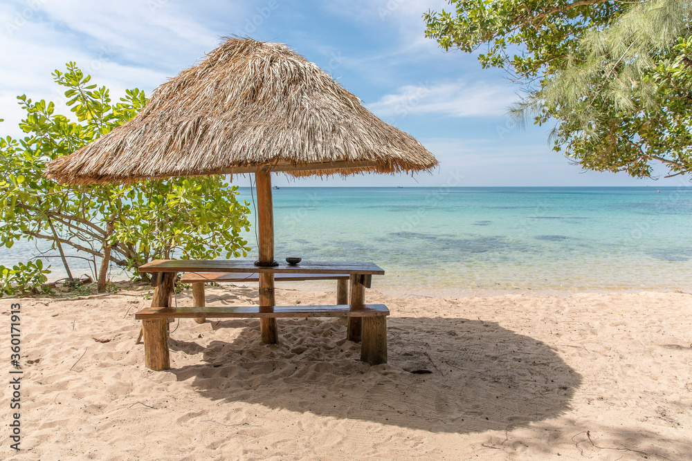 Fototapeta premium Beach Umbrella and Seat, Sunset beach, Koh Rong Samloem island, Sihanoukville, Cambodia.
