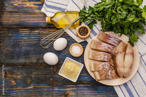 Photography Raw fillet of saithe and frying ingredients
