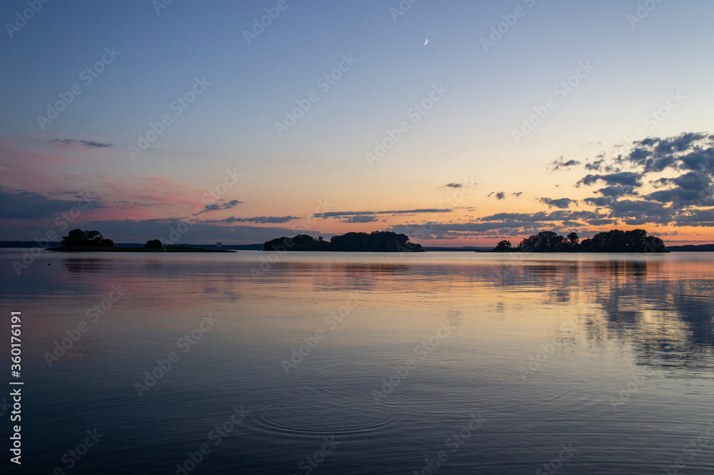 Magical fairytale sunset in the evening on the lake