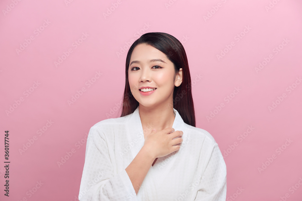 attractive asian woman skin care image on pink background