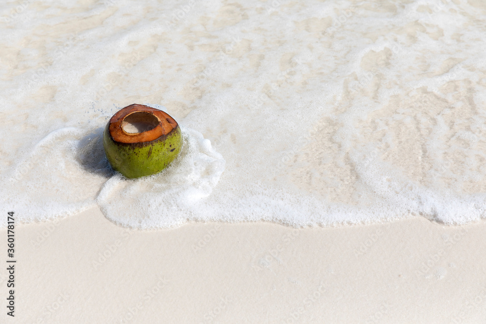 Fresh cut coconut on the beach, Saracen bay beach, Koh Rong Samloem island, Sihanoukville, Cambodia.