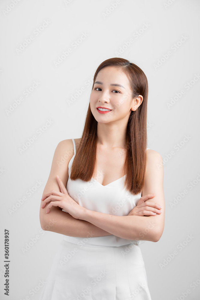 Portrait of young attractive Asian woman isolated over white background. Portrait of young attractive Asian woman isolated over white background.