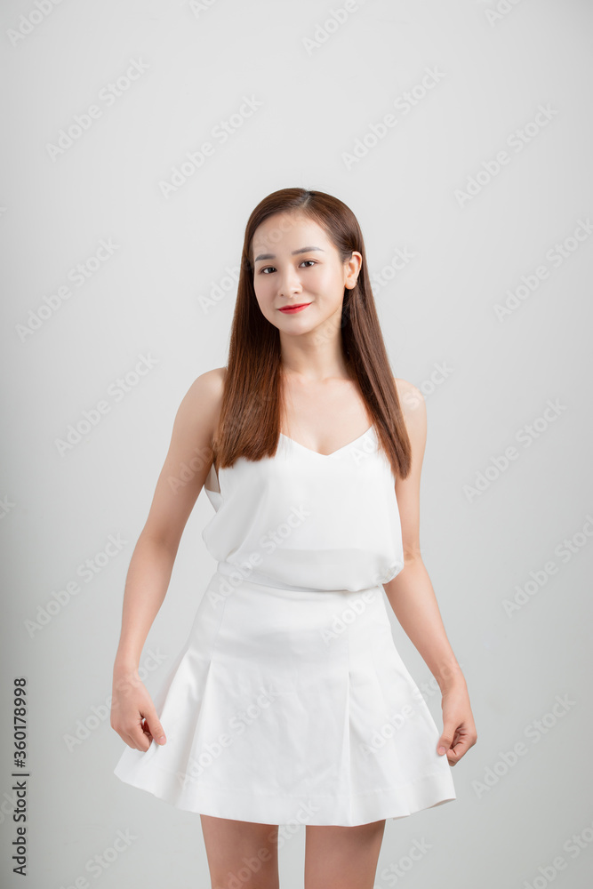 Portrait of young attractive Asian woman isolated over white background. Portrait of young attractive Asian woman isolated over white background.