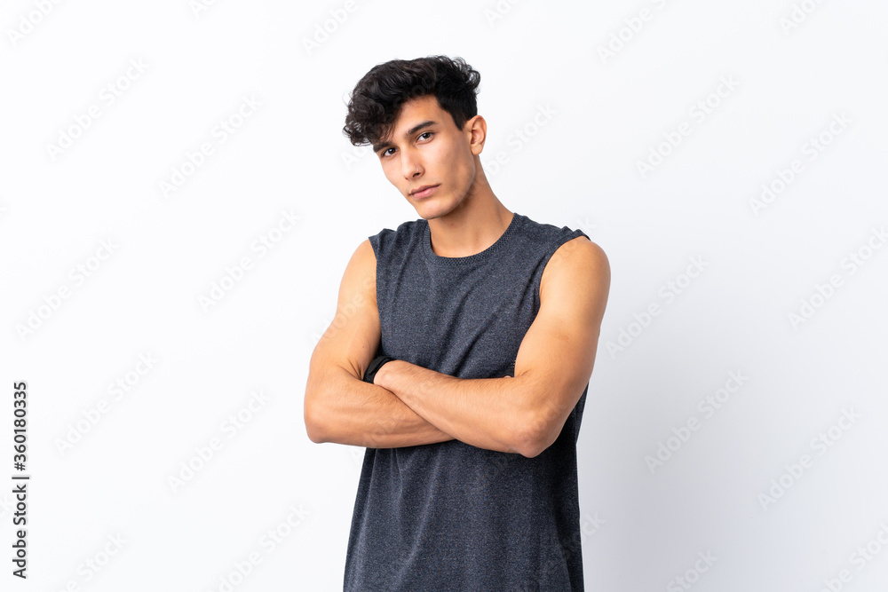 Young Argentinian sport man over isolated white background with arms crossed Young Argentinian sport man over isolated white background with arms crossed