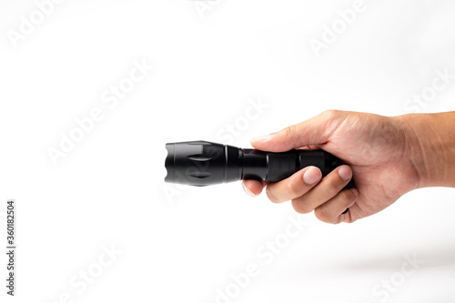 Hand holding a flashlight, isolated on white background