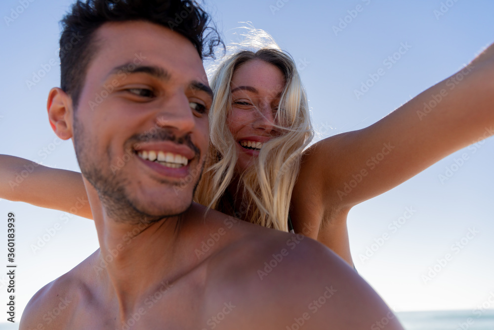Caucasian couple enjoying time at the beach