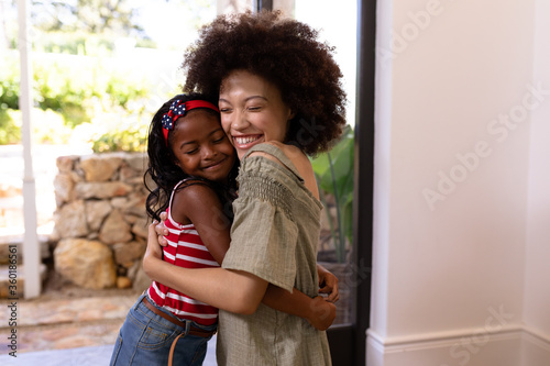 Mixed race girl enjoying her time at home and cuddling at home photo