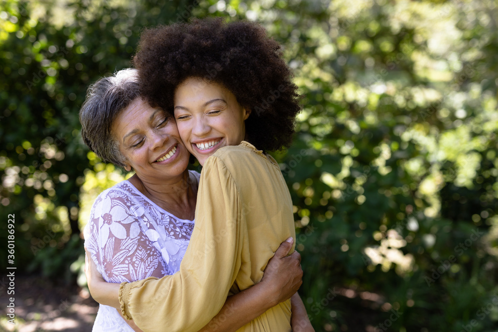Senior mixed race woman and her daughter enjoying their time at a garden