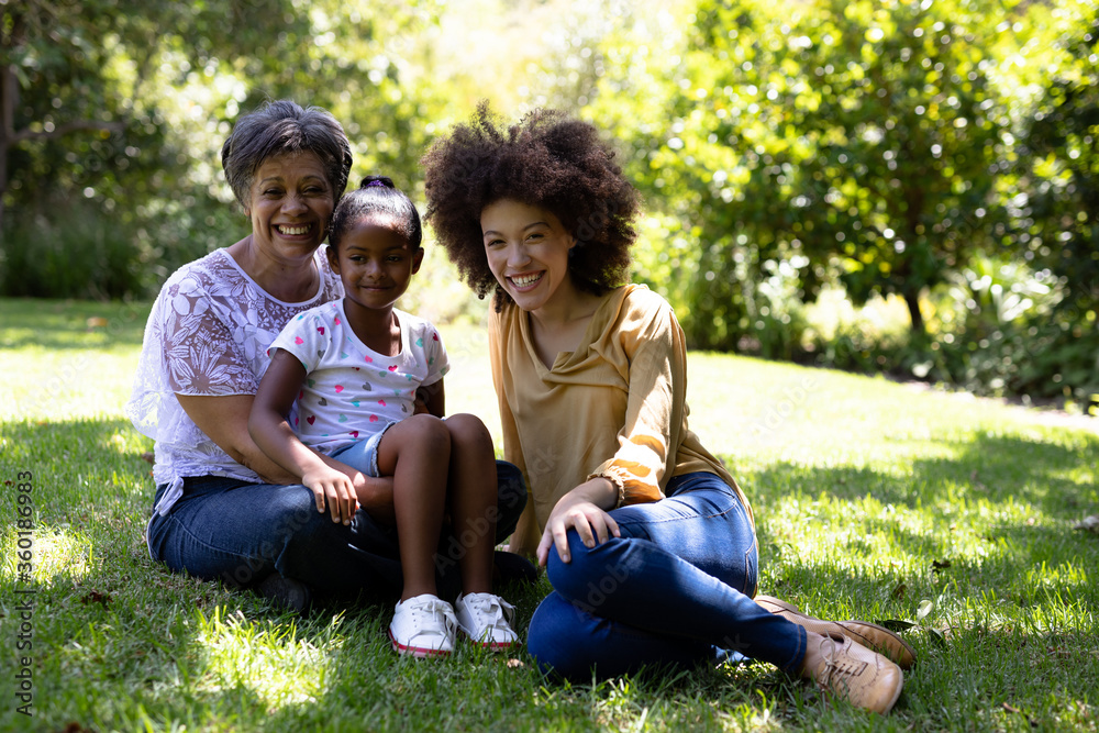Multi-generation mixed race family enjoying their time at a garden Multi-generation mixed race family enjoying their time at a garden
