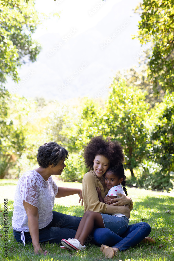 Multi-generation mixed race family enjoying their time at a garden Multi-generation mixed race family enjoying their time at a garden