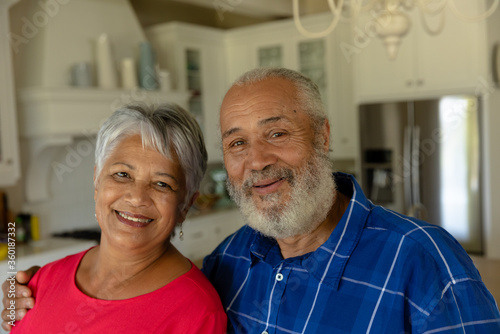 Happy senior couple looking at camera