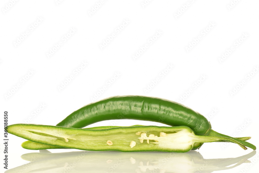 Green chili pepper, close-up, on a white background. Green chili pepper, close-up, on a white background.