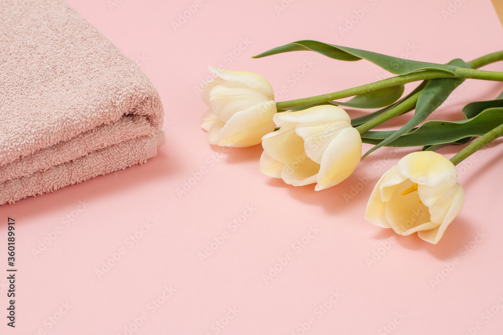 Soft terry towels with flowers on a pink background. Soft terry towels with flowers on a pink background.