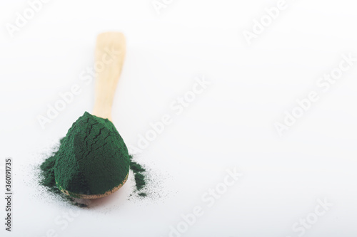 Chlorella single celled green algae. Detox superfood on the white background with sopy space photo