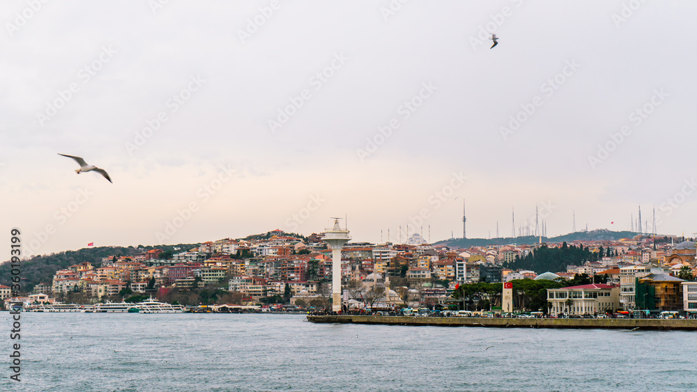 Istanbul - Turkey - 01/24/2019 : Most tourists must have taken a walk in the Uskudar seaside with the beautiful view of the bridge and Maiden's Tower