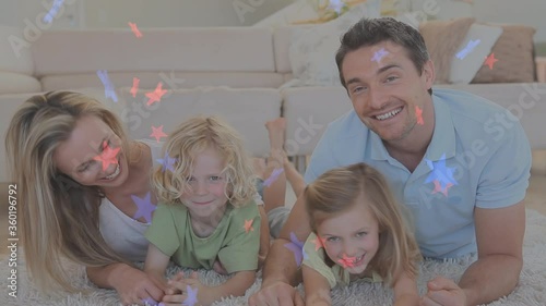 Wallpaper Mural Animation of red and blue stars floating over Caucasian family playing together Torontodigital.ca